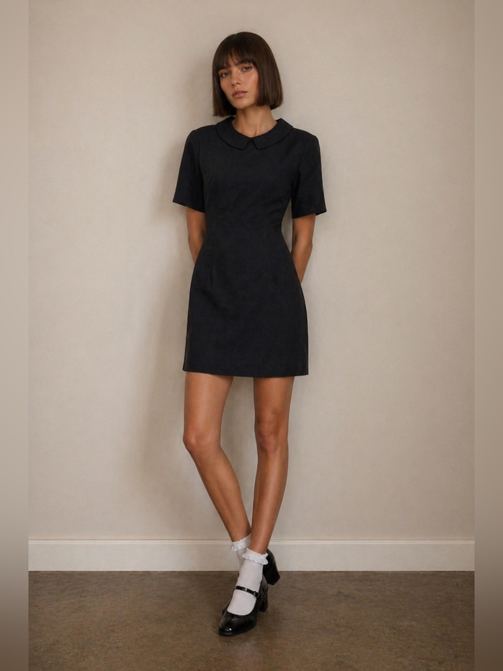 50’s style Peter Pan color black mini dress.